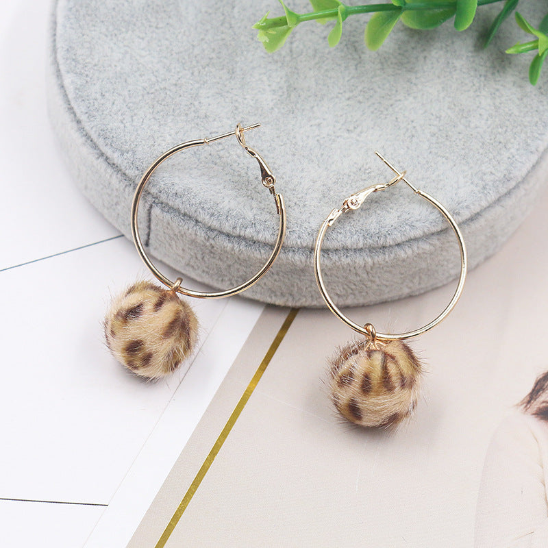 Leopard print fur ball and gold earrings