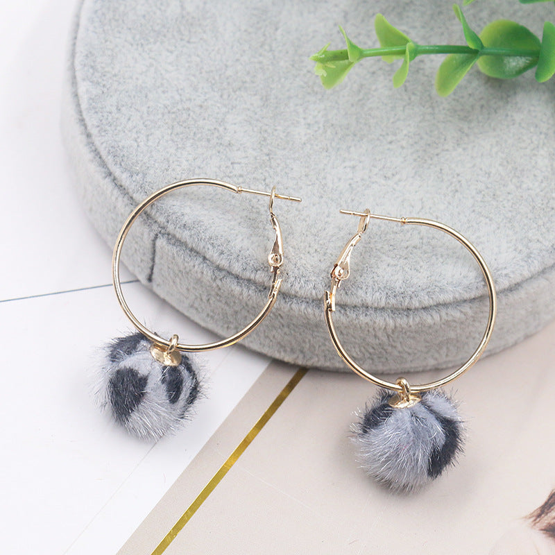 Leopard print fur ball and gold earrings