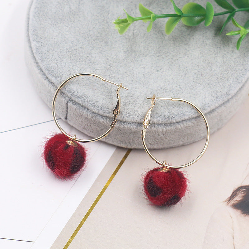 Leopard print fur ball and gold earrings