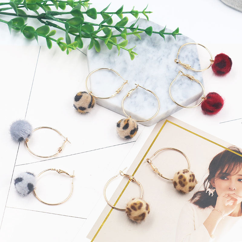 Leopard print fur ball and gold earrings