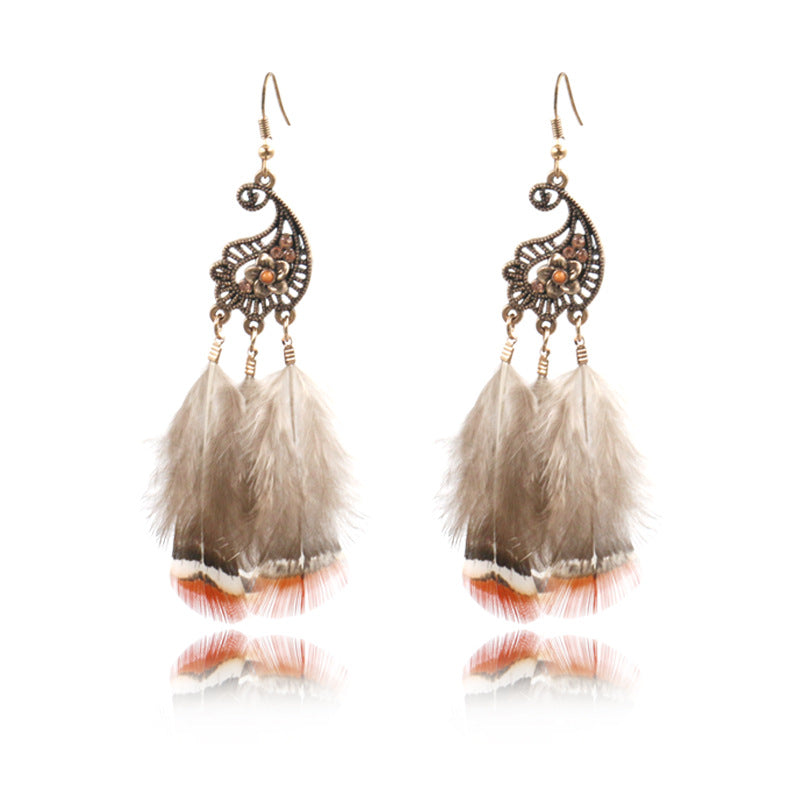 Peacock-studded pierced feather earrings