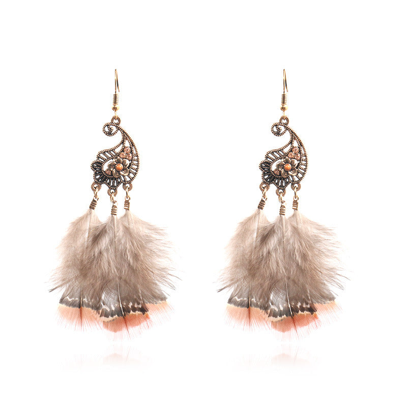 Peacock-studded pierced feather earrings